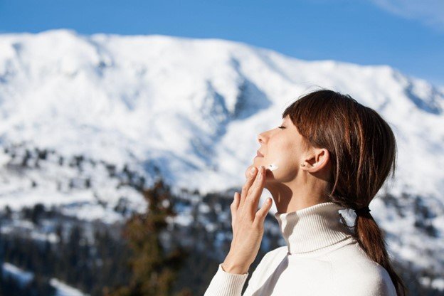 crema solar nieve